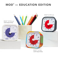 Three Time Timer MOD visual timers are shown together. The headline on the photo reads " MOD - Education Edition." The first timer shown is the MOD 120 Minute (sold separately). The second timer shown is the Time Timer MOD Tie-Dye Edition (sold separately) and the last time shown is the Time Timer MOD 60 Minute Visual timer with a charcoal case. 