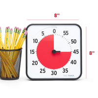 The Time Timer® Original 8” visual timer is shown next to a cup of pencils. The red disk is set at the 45 minute mark. The time is as tall as the cup of pencils. The measurements of the timer are labeled on each side. Each side is measured at 8 inches each. 
