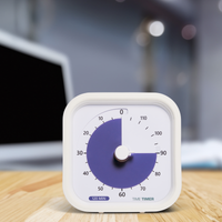 The Time Timer MOD 120-minute visual timer is shown on a work desk with a laptop in the background. The bold purple disk is set to 90 minutes to imply a 90 minute focused work session.