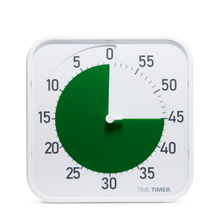 Wall-mounted timer with a green disc indicating time on a white background