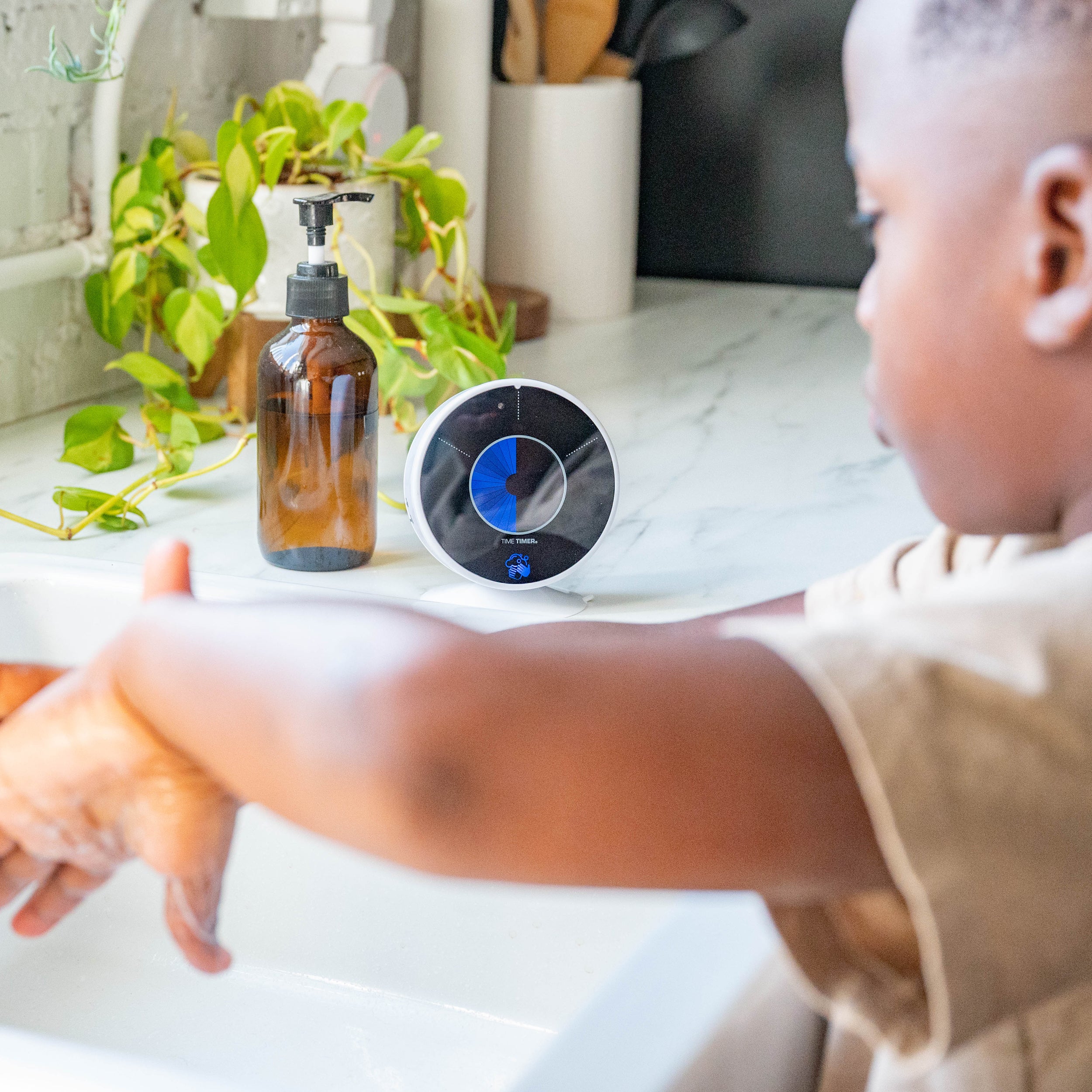 Time Timer Wash being used by a child for handwashing