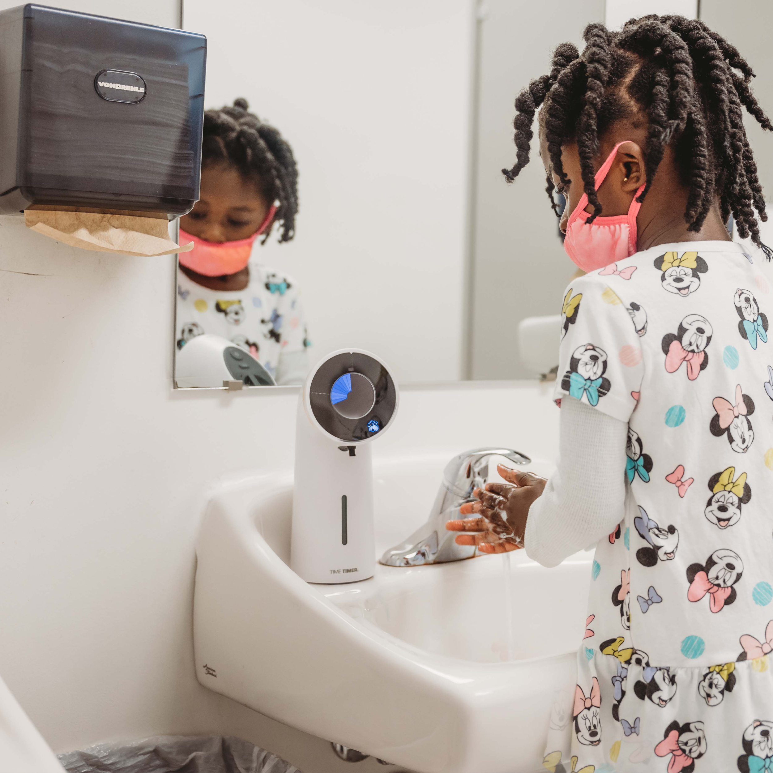 Time Timer® WASH + Soap Dispenser being used to teach handwashing 