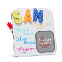 Time Timer® MOD Accessory - Dry Erase Board showing a checklist routine schedule including "Brush Teeth", "Get Dressed", and "Breakfast." Magnetic letters spell out the name SAM. A doodle of a Sunshine and a "Good Morning!" message is displayed on the right side of the board. The visual times is greyed out and marked as "Timer Sold Separately" 