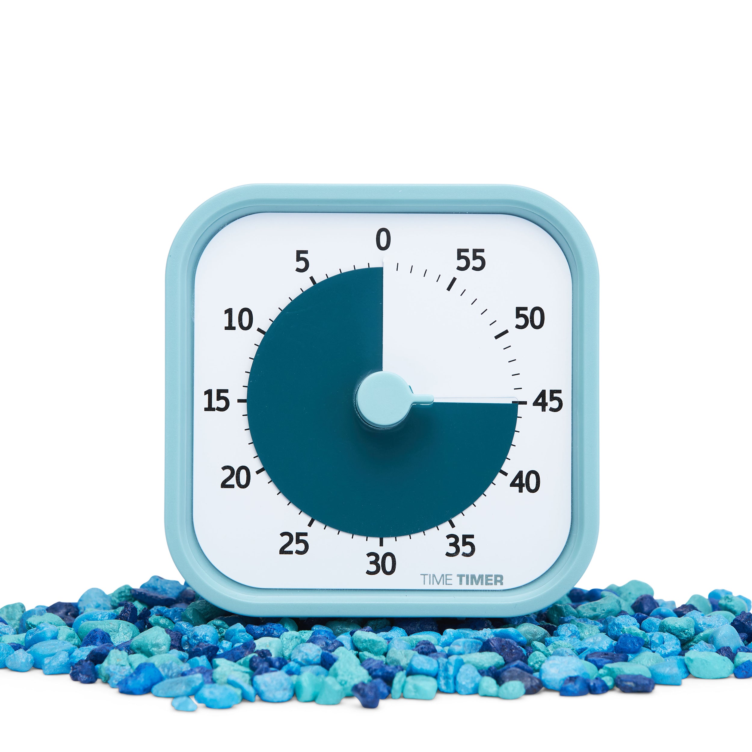 Time Timer MOD - Home Edition - this visual timer is part of the new Home Edition Collection of limited edition colors of the Time Timer MOD visual timers. Pictured is the Lake Day Blue timer. Exterior is a light calming blue, while the colored disk is a darker teal-blue color. Pictured atop aquarium rocks to bring out the blue colors and calming nature. .